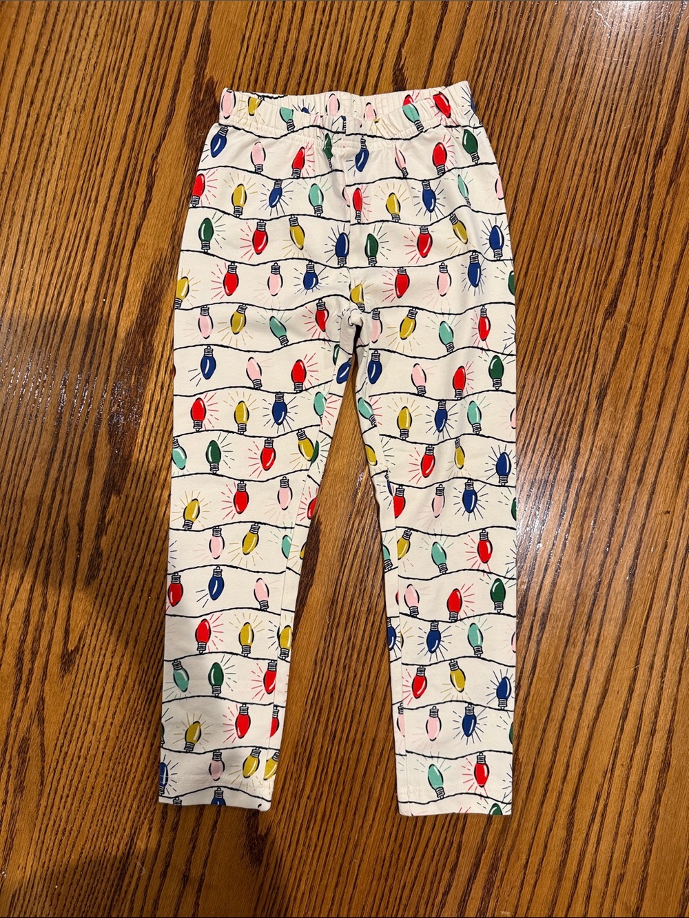 Hanna Andersson Cream Leggings with Multicolor Holiday Light Print
